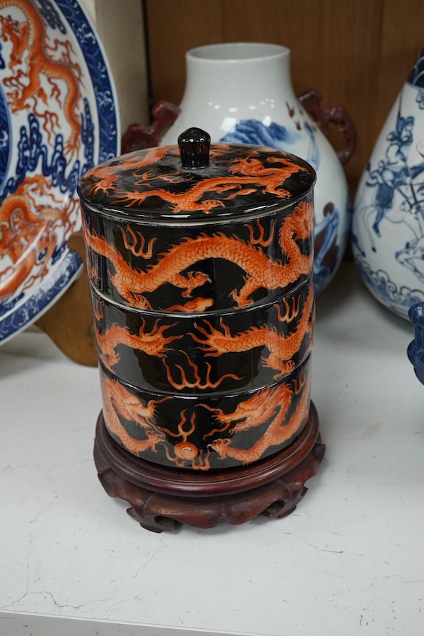 Three blue and white Chinese porcelain vases, a similar jar and cover, plus three stacking jars and covers on stand, a large dragon designed charger on stand and a similar decorated vase, charger 39cm diameter (7). Condi